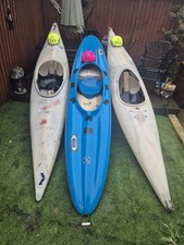 2 White Kayaks and 1